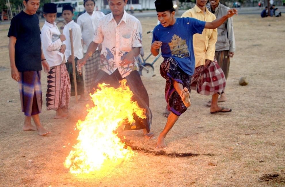 ***EXCLUSIVE*** KEDIRI, INDONESIA - OCTOBER 3: Students play Fire Football at the boarding school Lirboyo on October 3, 2012 in Kediri, Indonesia. THE PREMIER League boasts some of the hottest stars in the world &ndash; but they&rsquo;ve got nothing on these fiery
