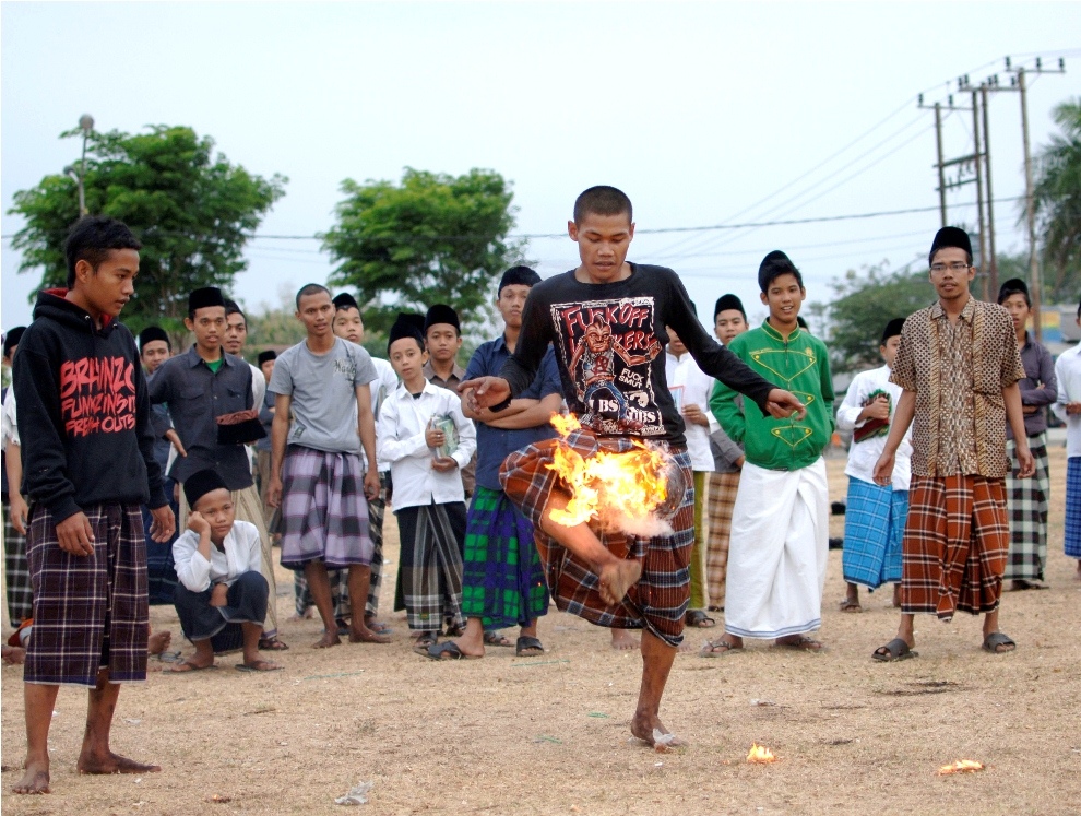 ***EXCLUSIVE*** KEDIRI, INDONESIA - OCTOBER 7: Students play Fire Football at the boarding school Lirboyo on October 7, 2012 in Kediri, Indonesia. THE PREMIER League boasts some of the hottest stars in the world &ndash; but they&rsquo;ve got nothing on these fiery